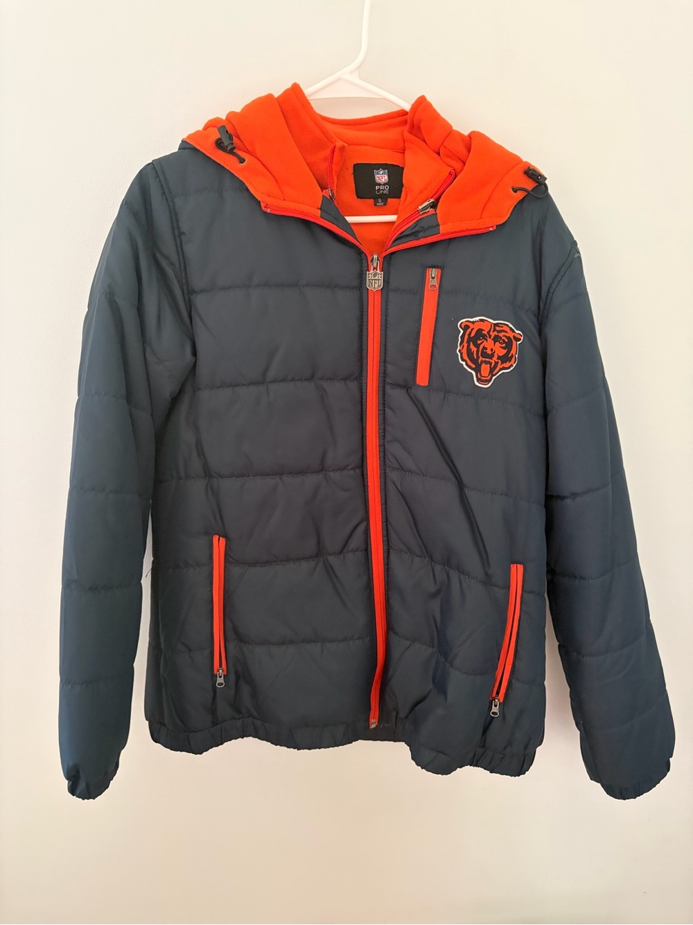NWOT NFL Orange Pro Line women’s Jacket with Black Logo Tag. Size small.